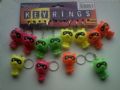 Card of 12 Wobbley Head Racoon keyrings Part No.AWX2617